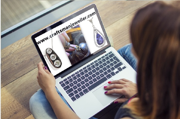 laptop pc with high class jewellery on screen advertising craftsmanjeweller.com is for sale 