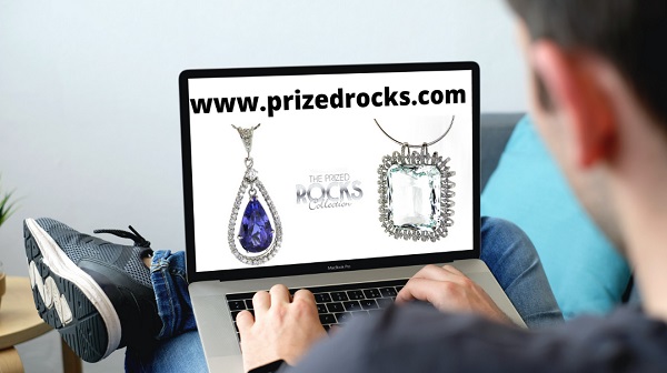 laptop screen showing museum quality jewellery items and prizedrocks.com domain name for sale