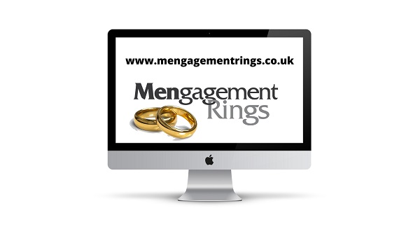 two gold men's wedding rings mengagement rings lgbt community equality displayed on desktop pc screen