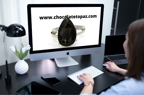 chocolate topaz gemstone ring on desktop pc screen