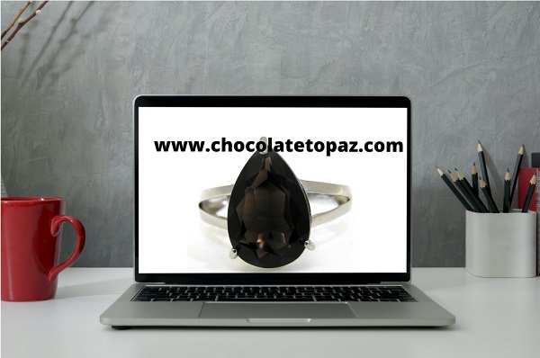chocolate topaz gemstone ring displayed on laptop 