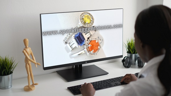 laptop pc showing superb gemstone rings promoting sparklinggemstones.com domain name is for sale